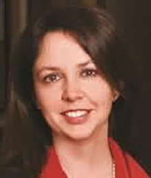 Leslie Kroeger, close up shot of Caucasian woman with brown hair, wearing a red collared shirt