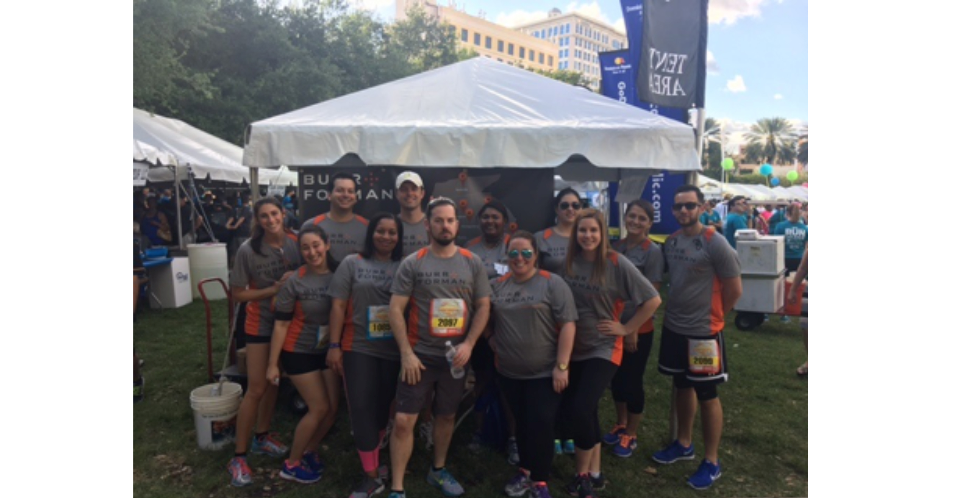 FLAYLD_Health+Wellness_BurrForman_CorporateRun Burr Forman team members are participating in a corporate run, pictured in front of the tent