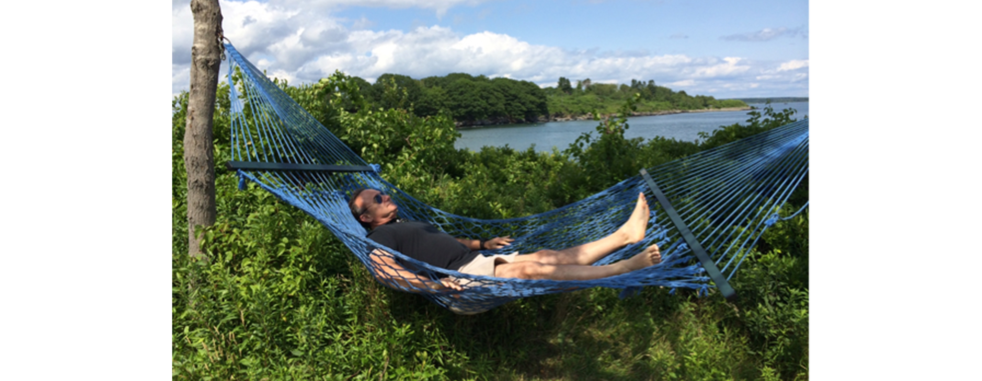 FLAYLD_HealthWellness_JudgeGaryFlower_2016_White Judge Gary Flower relaxes on a hammock near a body of water