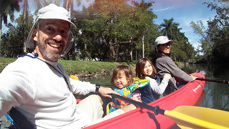 Judge Jason Dimitris is pictured with his family on a red canoe