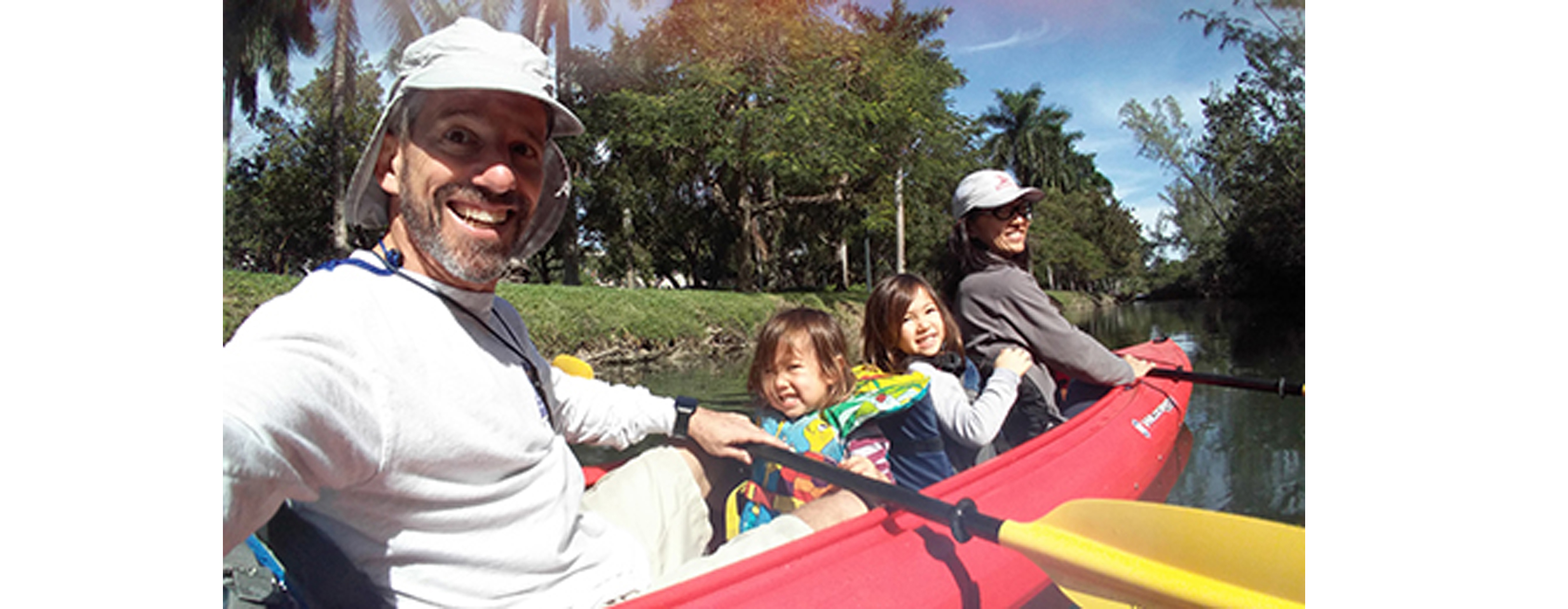 Judge Jason Dimitris is pictured with his family on a red canoe