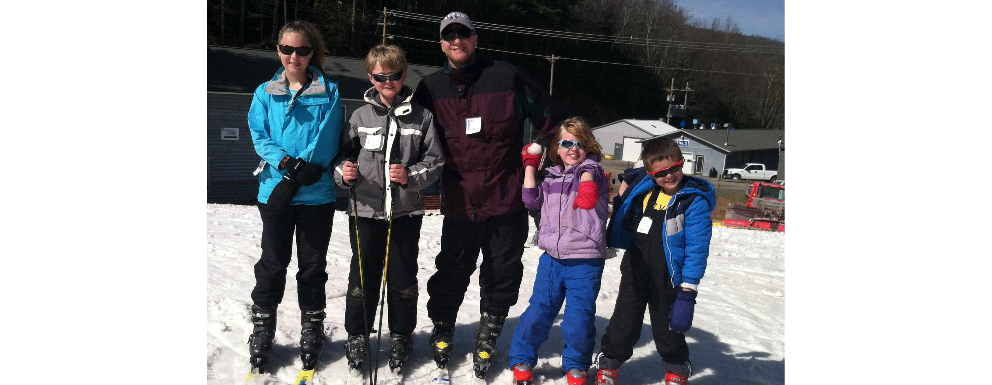 Judge Osterhaus is pictured with a group of children on a ski hill