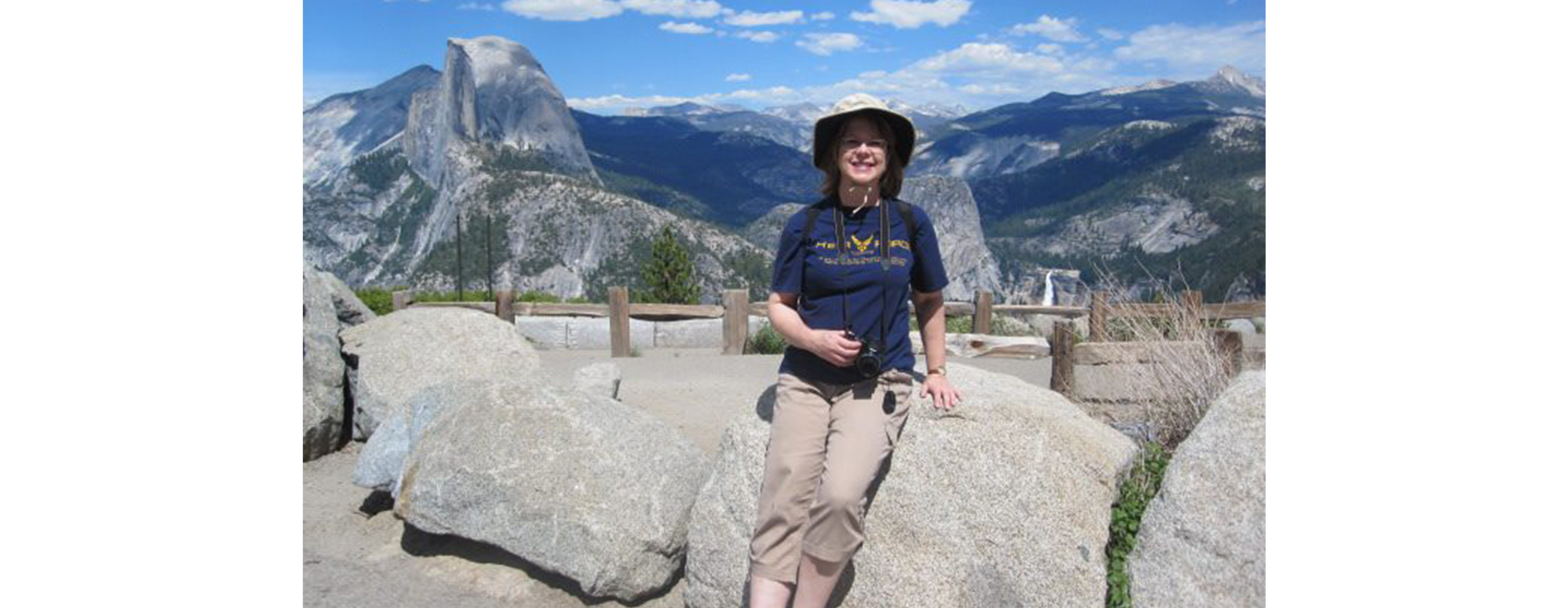 Judge Susan Kelseyis hiking in the mountains on a beautiful sunny day