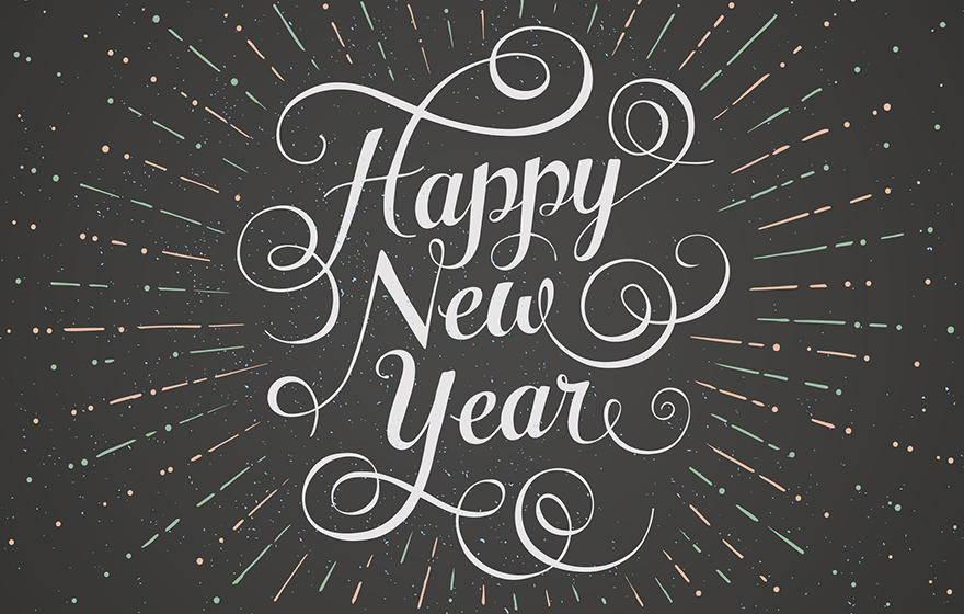 Happy New Year written in a white script font on a chalkboard background