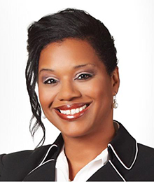 Julie Harris Nelson headshot, African American woman with white collared shirt and a black blazer