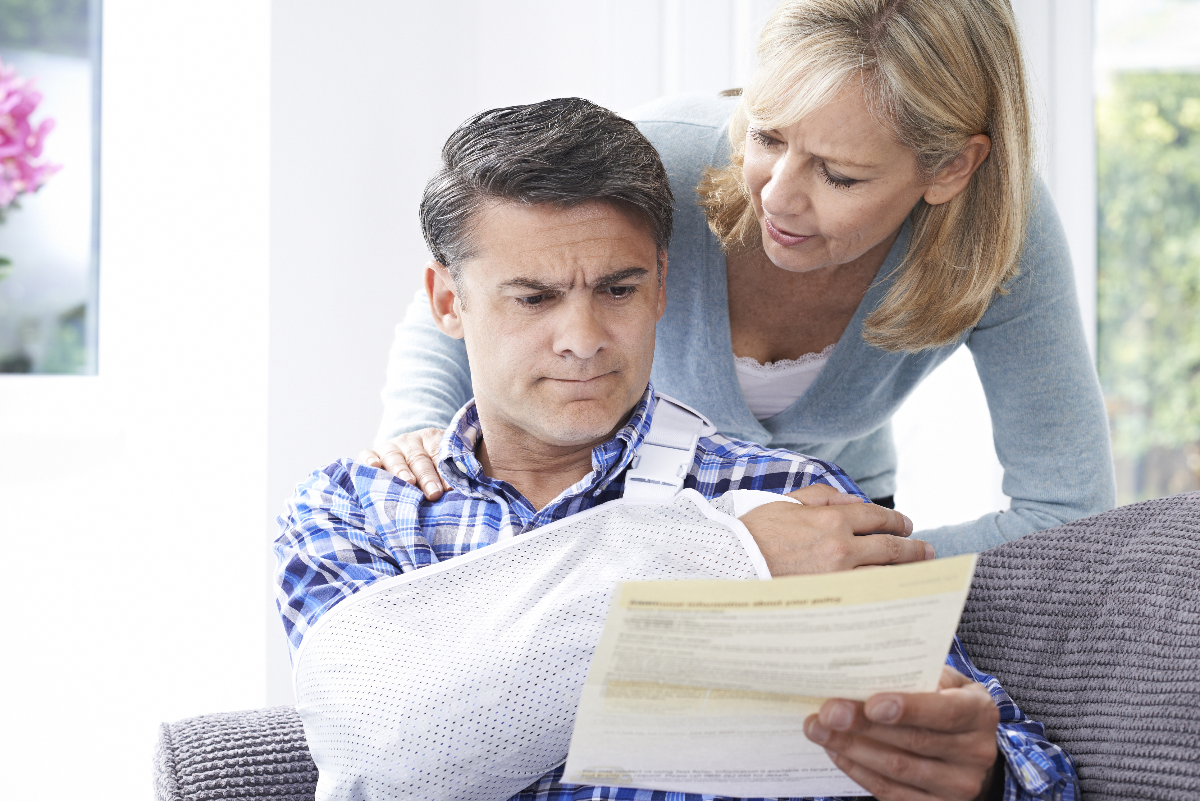 Caucasian Couple Reading Letter About Husband's Injury