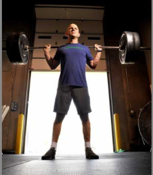 Bill Adams with barbell and weights