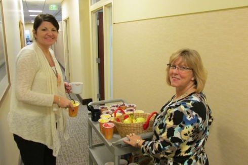 Foley_HealthFood 2 women pushing a cart with healthy food on it
