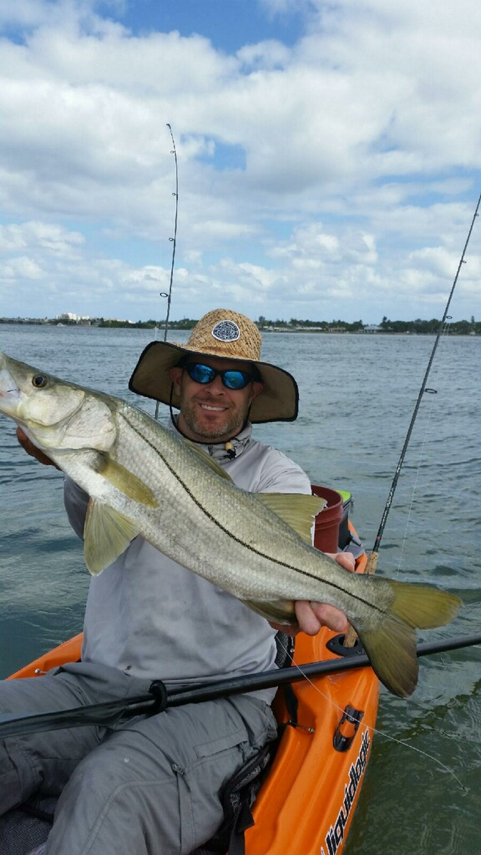 Ron Ponzoli fishing with large fish in hands