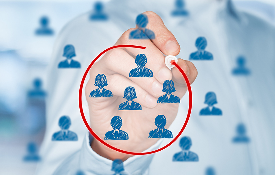 Segmentation Concept. Blue people icons on a white board with a professional person circling a segment of those people with a red marker