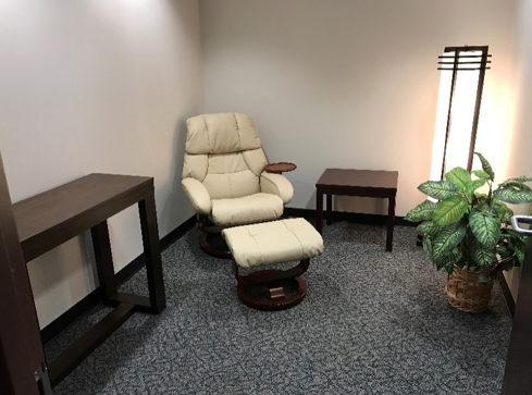 Lactation Room 1 comfortable chair in a private room, cream colored chair, image of tree, lactation room for nursing mothers
