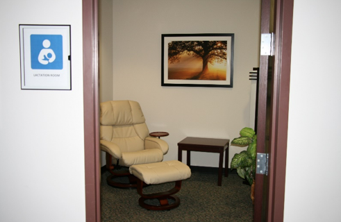 Lactation Room 2 comfortable chair in a private room, cream colored chair, image of tree, lactation room for nursing mothers