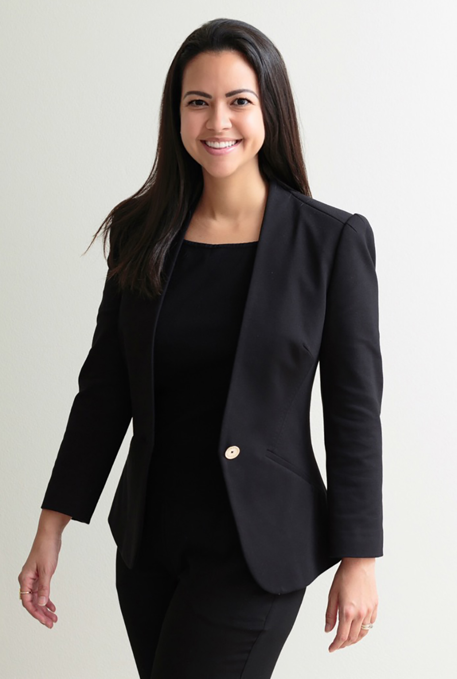 Kristen A. Corpion_Cropped Kristen A. Corpion, young female professional, long dark hair, wearing all black business suit